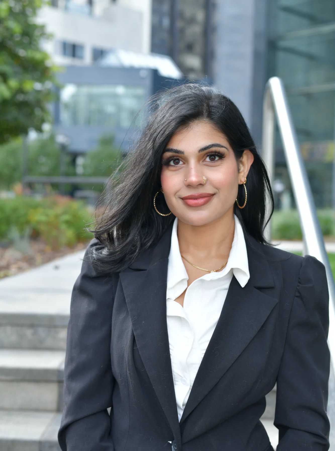 Arman Kaur, founder of Kore Creations, in a black blazer outside in Calgary